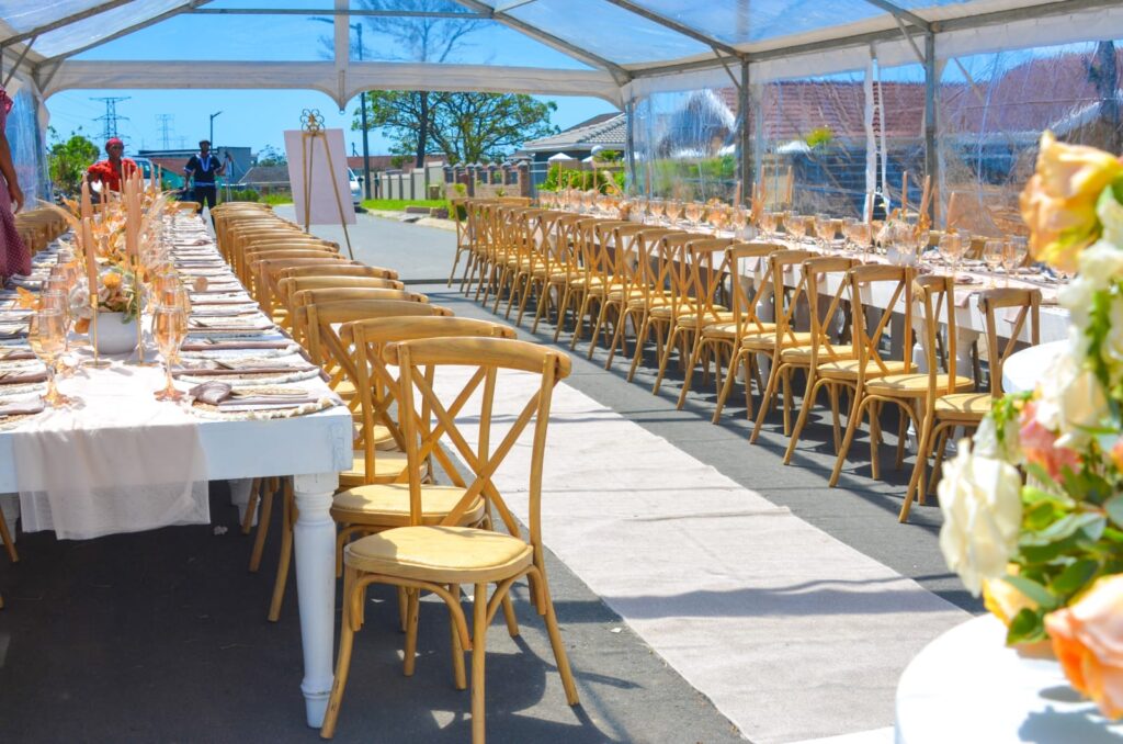 Wedding table and chair setup in a Clear Framed Marquee Tent